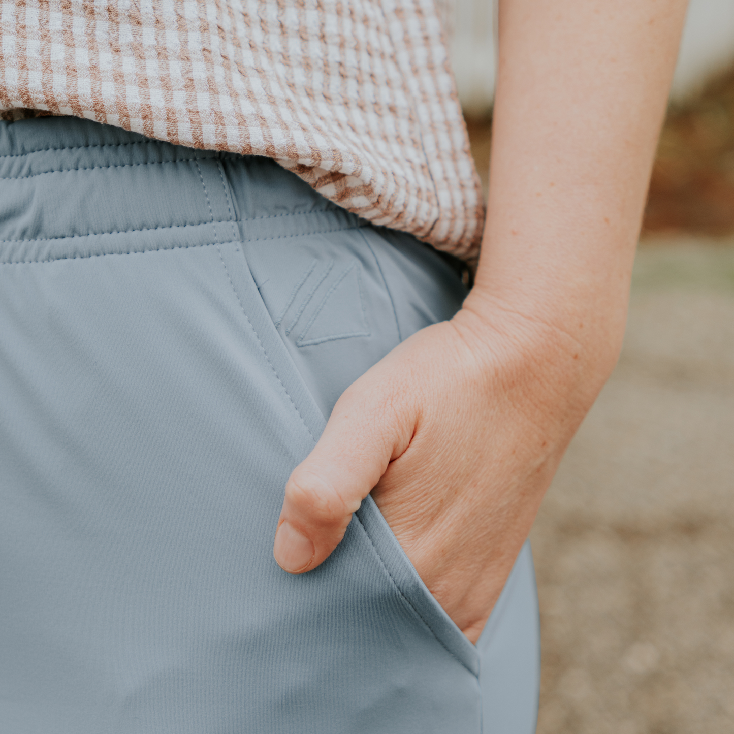 
                  
                    Person wearing light blue skirt with a blurred background
                  
                