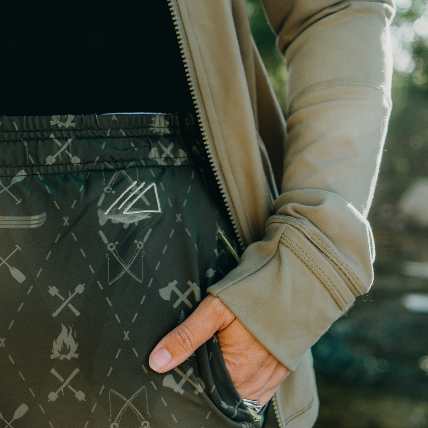 
                  
                    Person wearing skirt with pocket and logo
                  
                